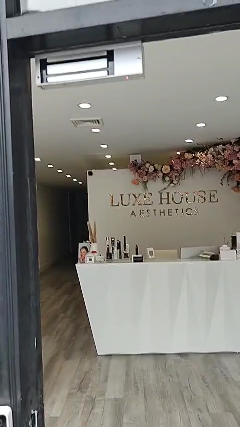 Overhead magnetic lock on a glass entrance from our work on Long Island