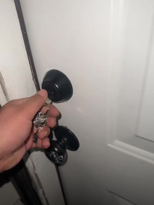 Black mechanical deadbolt and matching hardware on a residential door in Williamsburg